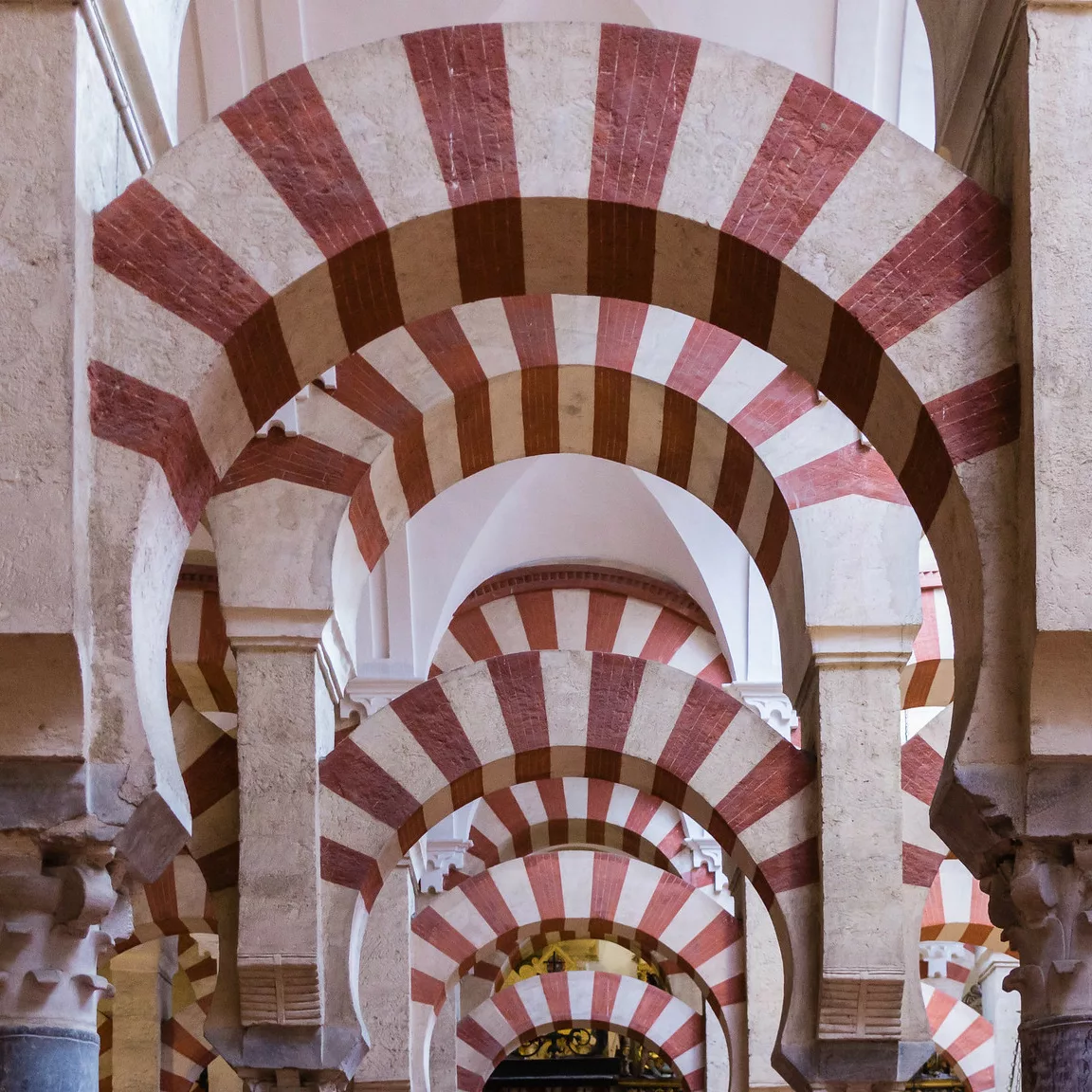 double red and white arches in the mosque-cathedral of cordoba 